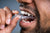 Man inserting a clear mouthguard